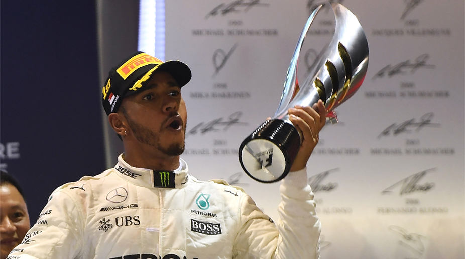 Singapore GP: Lewis Hamilton wins controversial race to extend championship lead