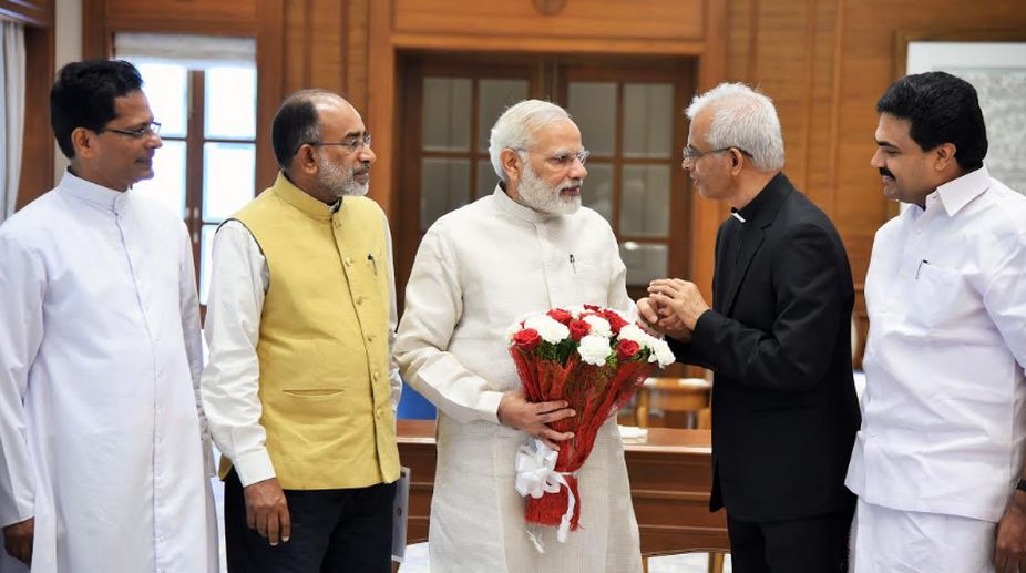 Rescued Kerala priest meets PM Modi, Swaraj