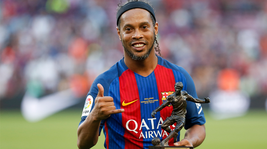Barcelona and Brazil legend Ronaldinho retires from football