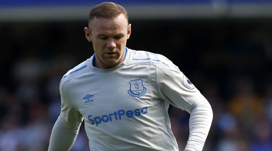 Banned Wayne Rooney gets lift to training