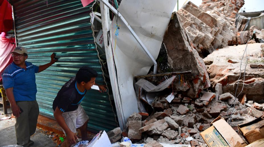 Deadly quake, hurricane a one-two punch for Mexico; 63 die