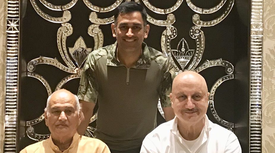 M S Dhoni strikes a pose with reel and real life dad