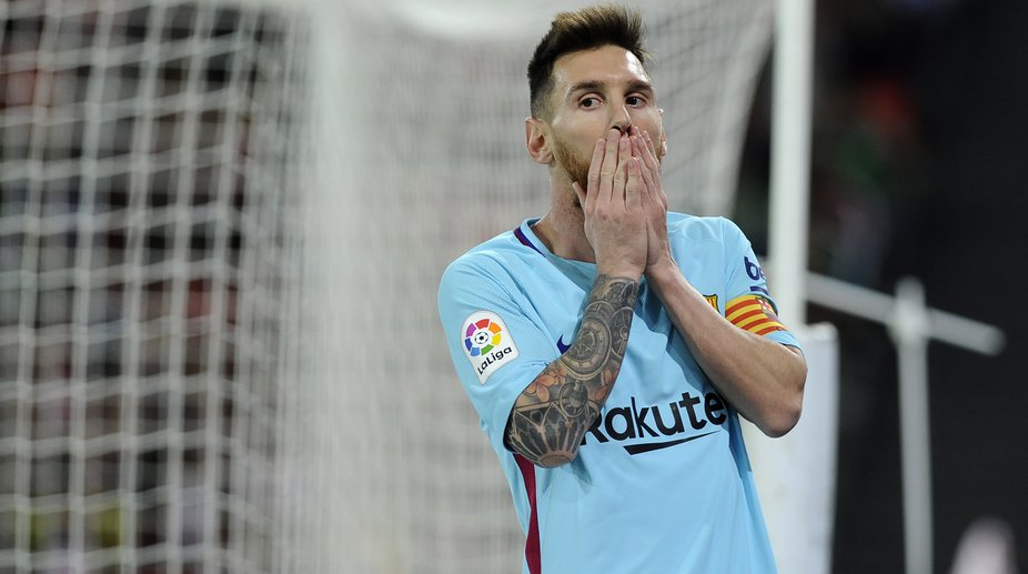 Messi maintains under-par Barcelona’s lead over resurgent Valencia
