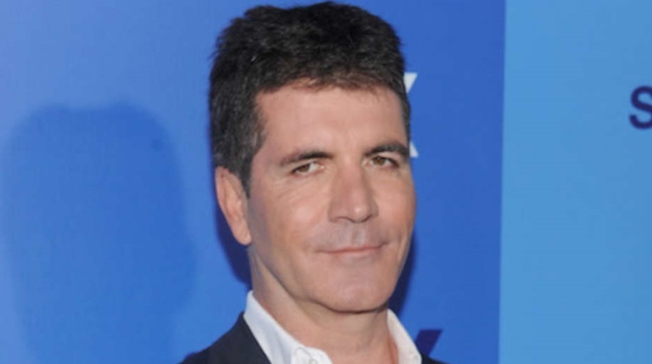 Simon Cowell takes advice from his late parents