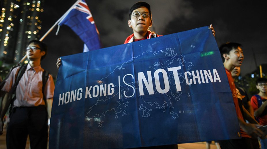 Defiant Hong Kong football fans boo China anthem at match