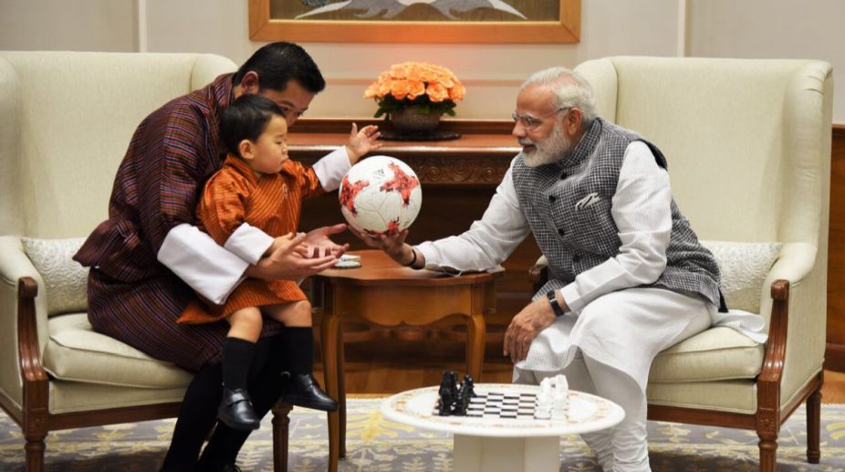 Modi gifts a football to Bhutan Prince