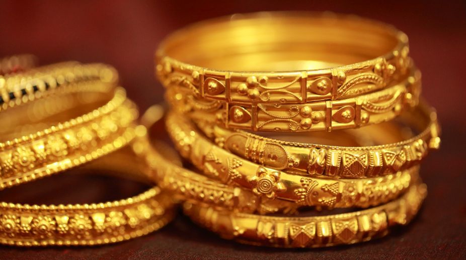 Gold slips Rs 100 on lacklustre demand