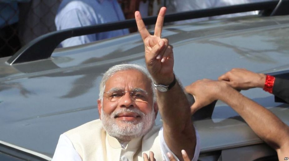 PM Modi flashes victory sign as BJP set to win Gujarat, Himachal