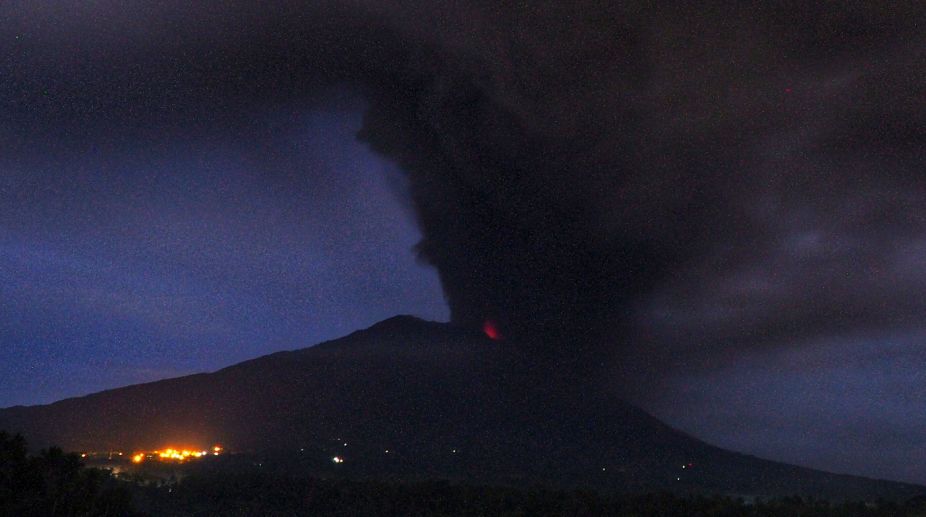 Bali volcano spews thick smoke and ashes