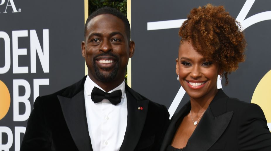 Sterling K Brown, who won a Golden Globe for Best Actor in Television series Drama, walked the red carpet with his wife Ryan Bathe dressed in a black tuxedo (Photo Credits: AFP) img
