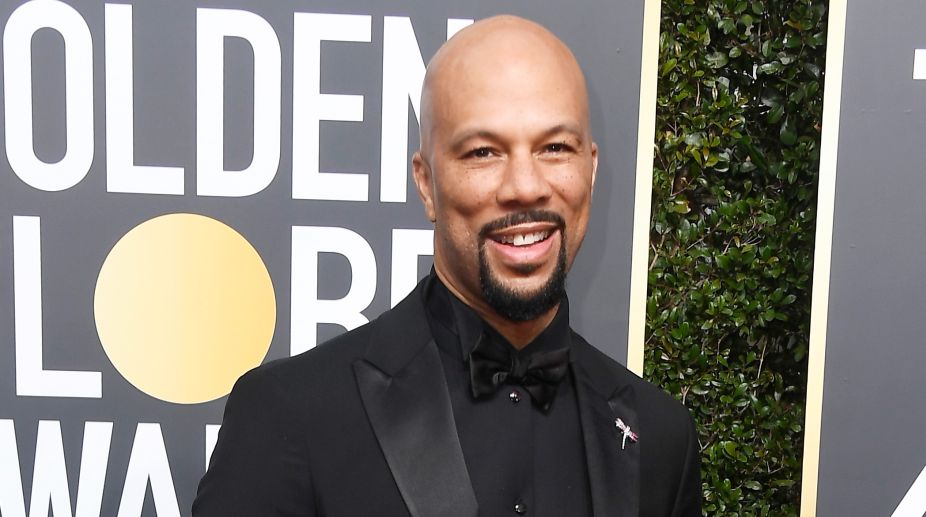 Rapper and actor Common arrives at the red carpet dressed in sharp black tuxedo (Photo Credits: AFP) img