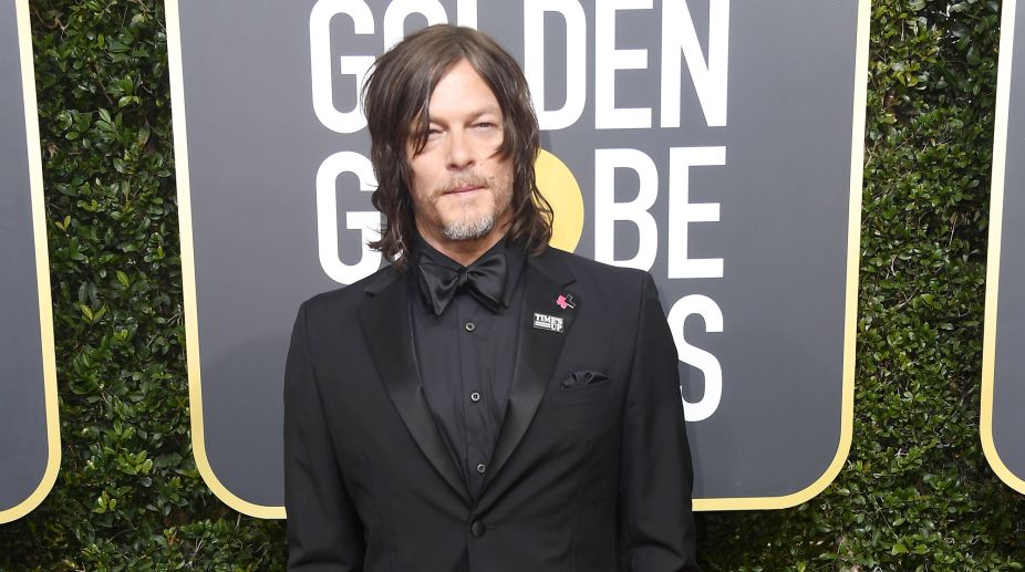 Norman Reedus also sported the Time's UP tag along with his black tuxedo (Photo Credits: AFP) img