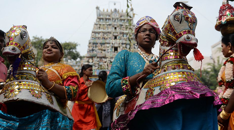 Students perform a 'Poikal kudhirai' folk dance during celebrations for Pongal, the Tamil harvest festival, at a college in Chennai on January 9, 2018. (Photo: AFP) img