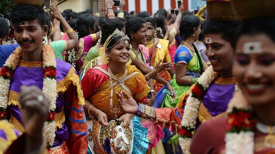 Students perform a 'Poikal kudhirai' folk dance during celebrations for Pongal, the Tamil harvest festival, at a college in Chennai on January 9, 2018. (Photo: AFP) img