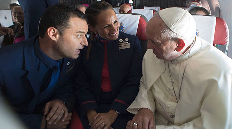 In a first, Pope Francis reads out wedding vows for couple on Chile flight