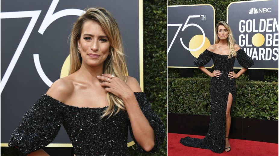 Renee Bargh walked the red carpet in her black off shoulder thigh high slit gown (Photo Credits: AFP) img