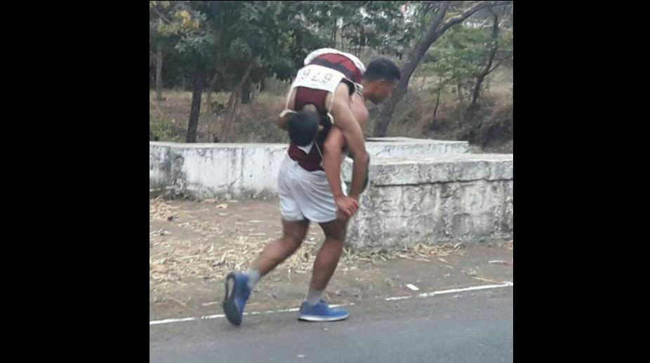 NDA cadet carries junior on back for 500m during race, earns kudos