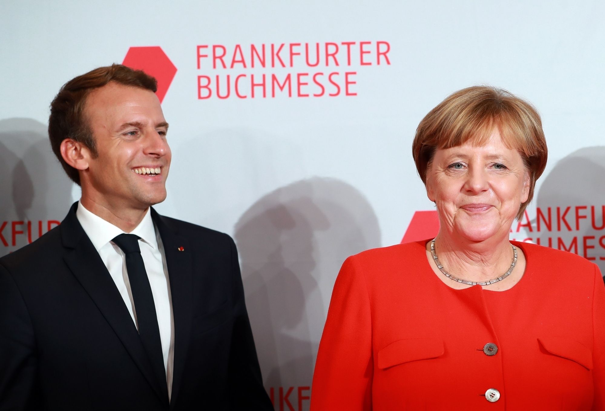 Macron, Merkel pledge common roadmap on eurozone reforms