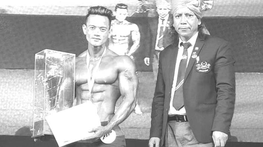 Hill man strikes gold in body-building contest