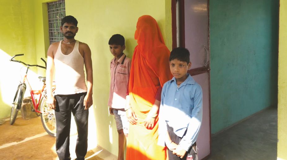 Beneficiary Ahivaran Jatav with his wife Swadesh and two sons at his new house in Unnao village in Datia district of Madhya Pradesh. (Photo: SNS)