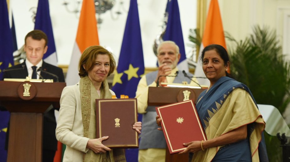 India, France sign military logistics support deal and 13 other agreements