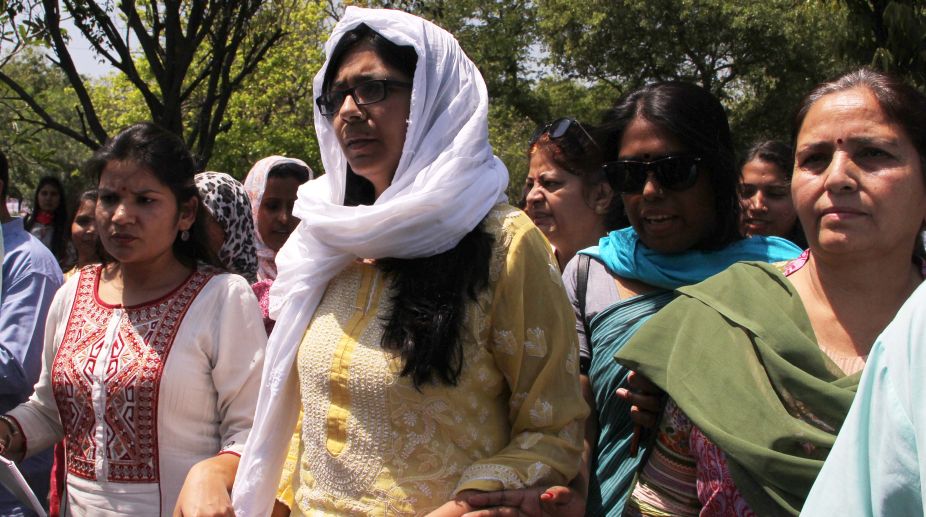 Swati Maliwal with supporters on the day of her indefinite fast against crime against women, at Rajghat in New Delhi's on Friday. (Photo: Ritik Jain)