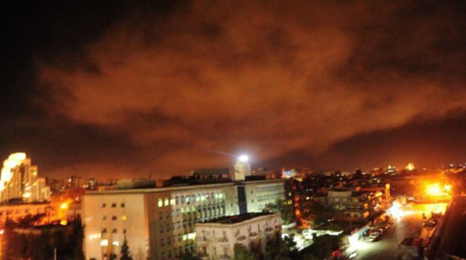 US-led coalition forces launch strikes on Syria, video shows Damascus getting hit