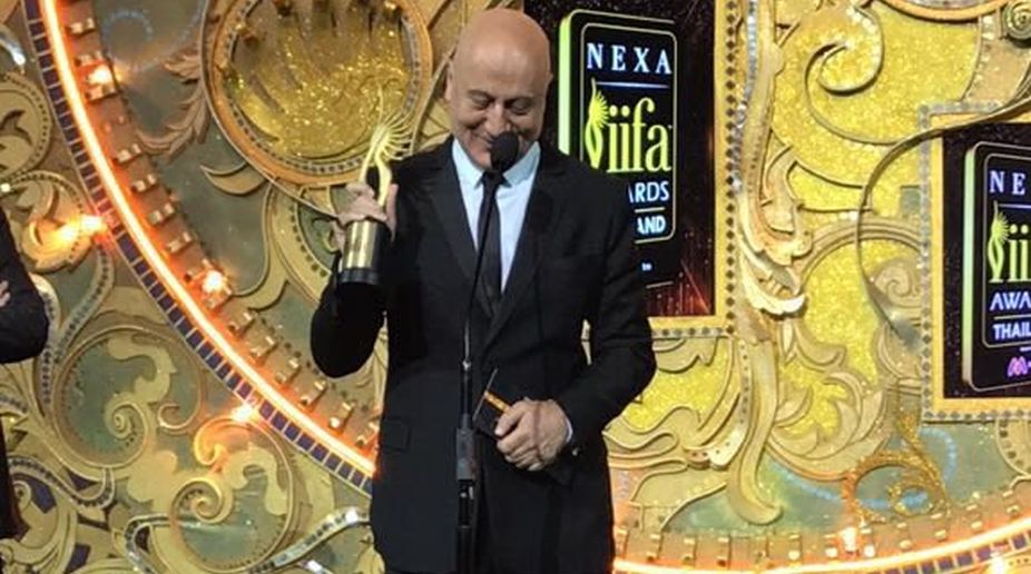 Anupam Kher dedicates award to struggling actors without godfathers