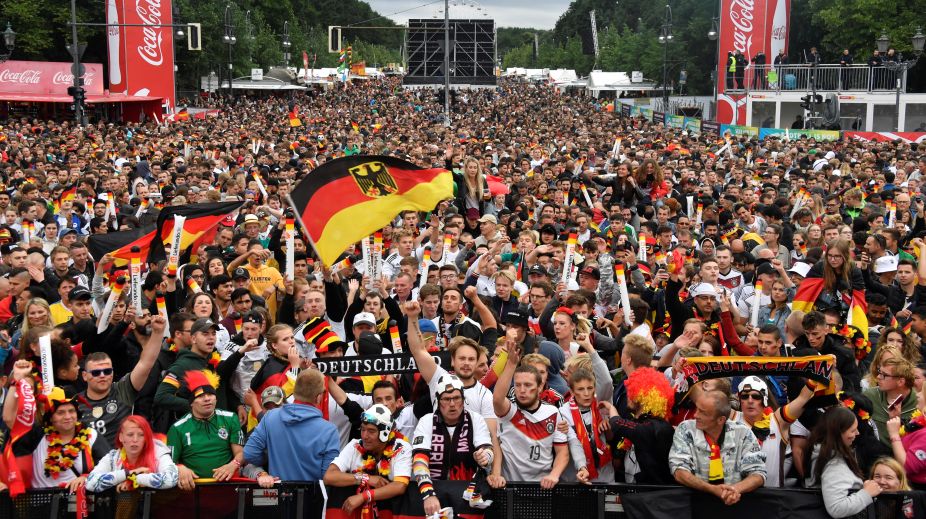 Fans dance in Berlin rain as Germany survive