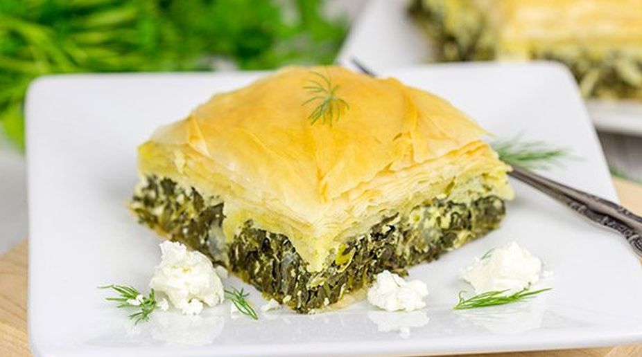Green herbs stuffed spicy spanakopita