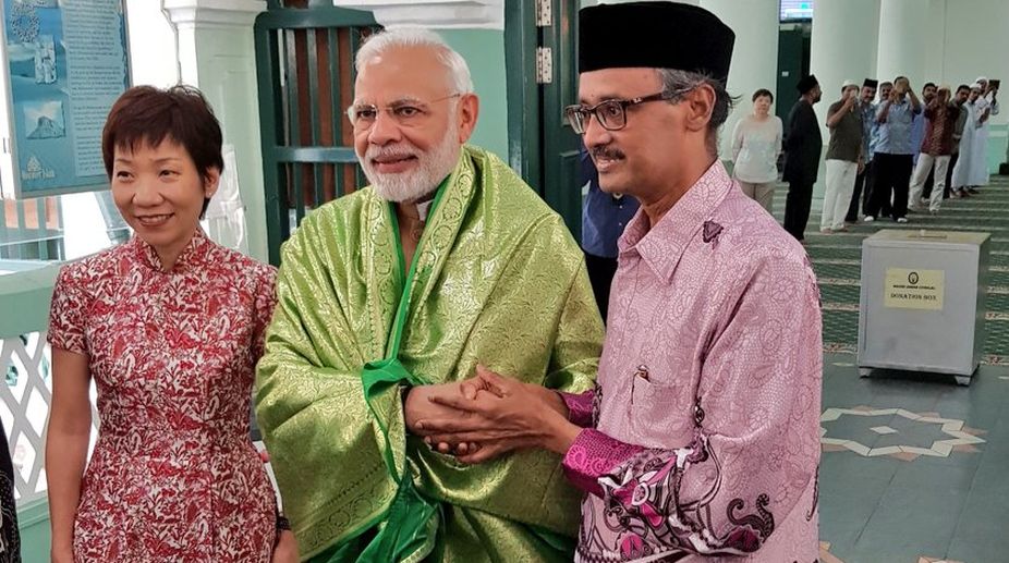 Prime Minister Narendra Modi accompanied by Singapore Culture Minister Grace Yien at Chulia mosque in Singapore on Saturday. (Photo: Twitter)