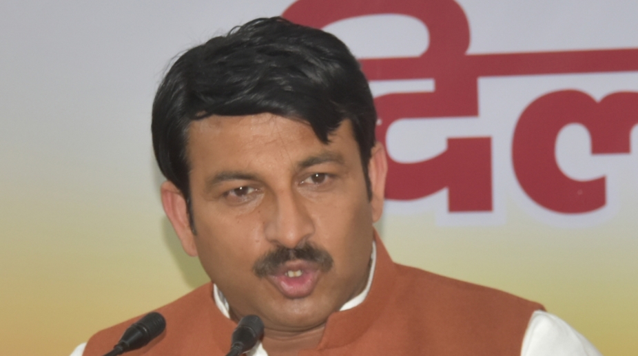 BJP workers stage protests over threat to Manoj Tiwari, wave black flags at Kejriwal