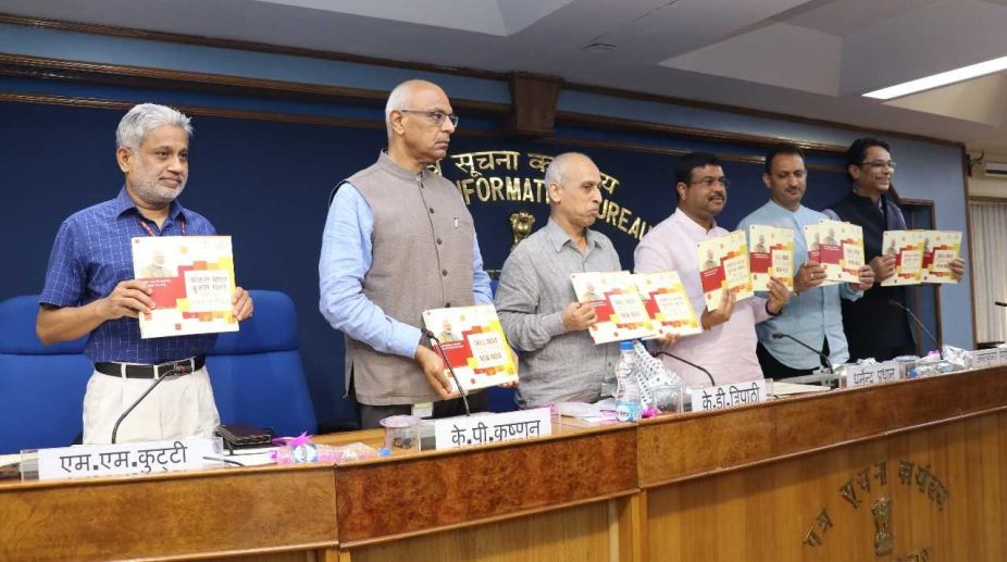 Union Minister Dharmendra Pradhan unveiling a commemorative booklet outlining the achievement and new initiatives under Skill India.