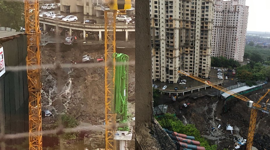 Mumbai rains throw life out of gear; 15 cars buried as complex wall collapses