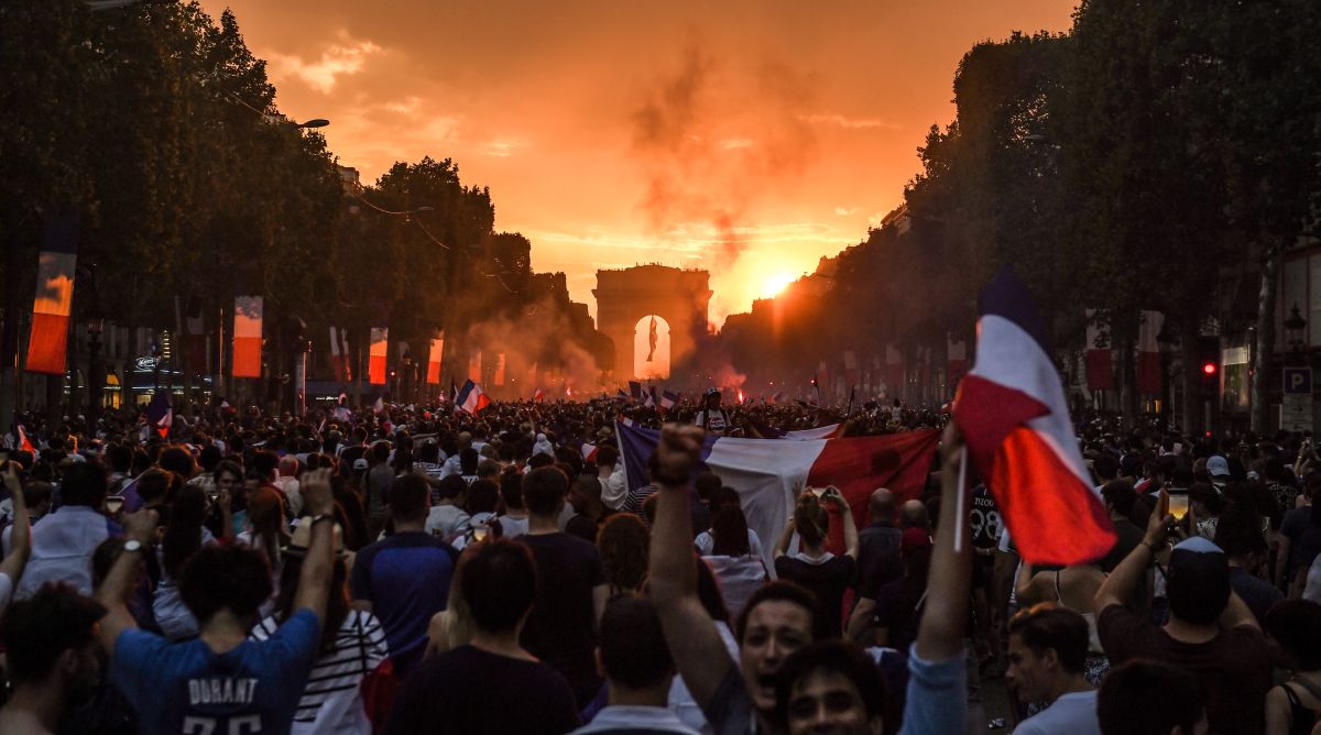 With flags, song, pride, French celebrate unifying victory