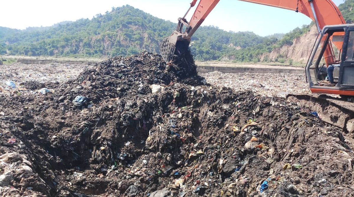Dumping of solid waste from town in village makes locals fume