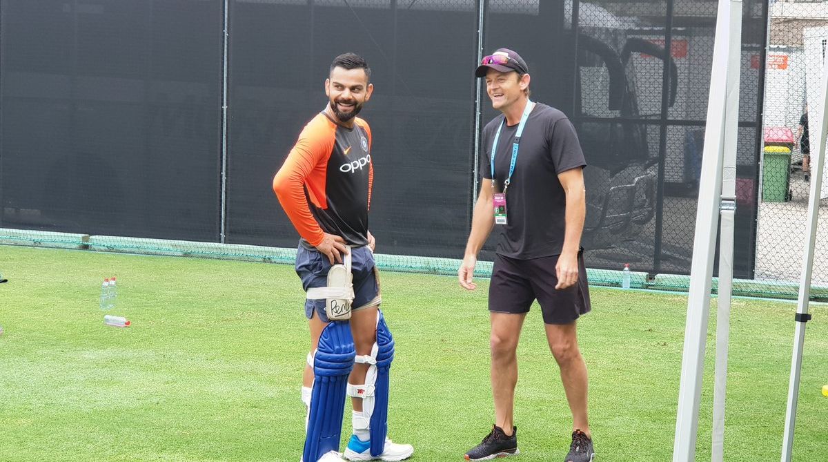 Virat Kohli catches up with Adam Gilchrist during training at The Gabba
