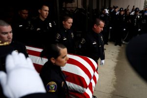 Slain police officer called ‘American hero’ at his funeral