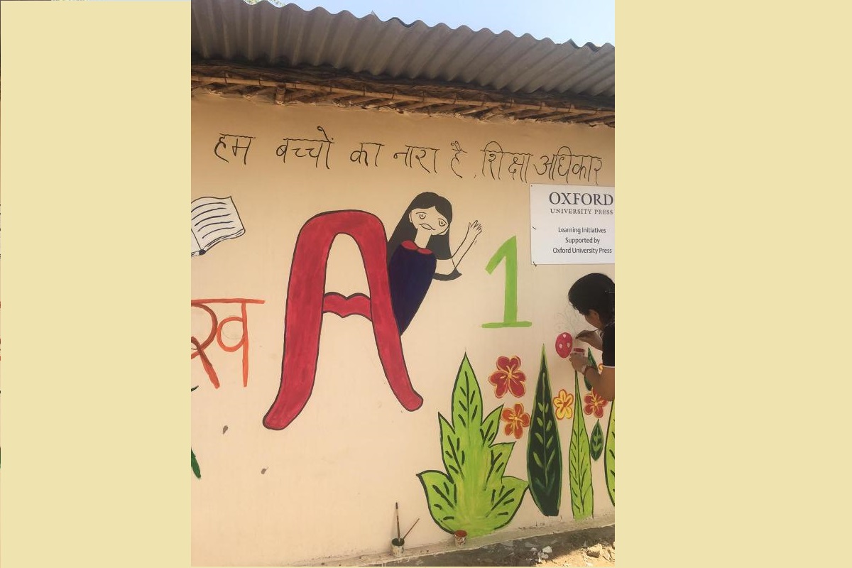 Oxford University Press employees paint a slum school on occasion of ‘World Art Day’