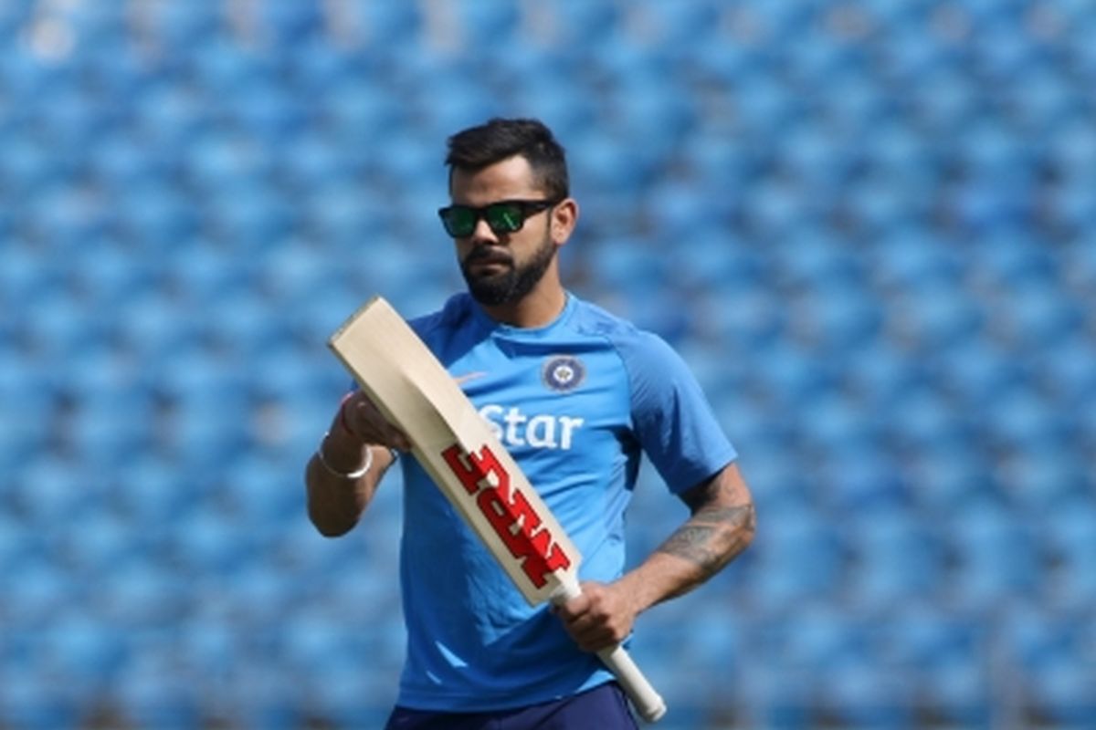 Virat Kohli steps in with ball at nets