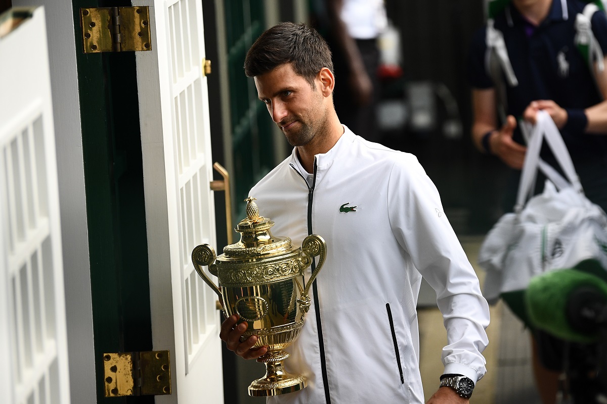 Djokovic saves match points to claim fifth Wimbledon title in record-breaking final