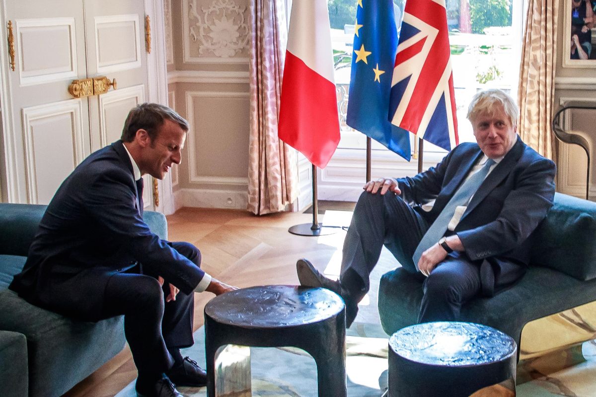 With foot on table, Boris speaks on Brexit deal with French President Macron