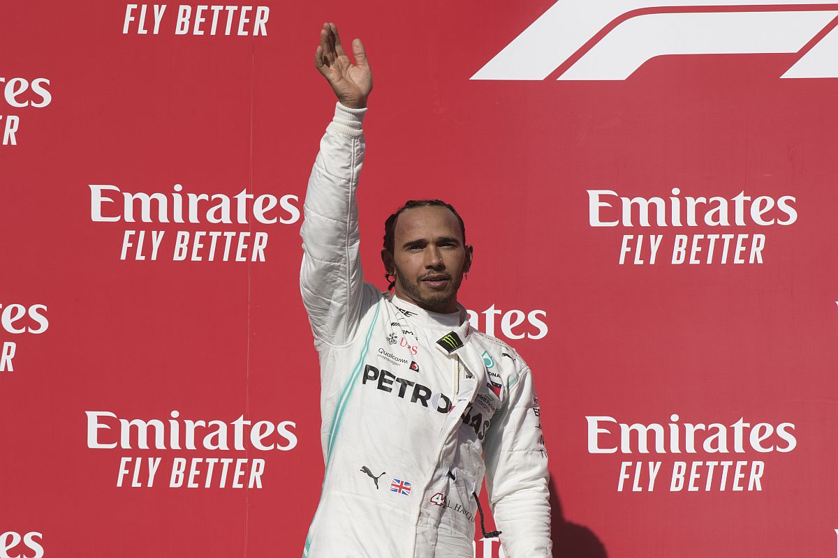 ‘Overwhelmed’ Hamilton wins sixth world title, closes in on Schumacher record