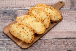 How to make restaurant style Cheesy Garlic Bread at home?