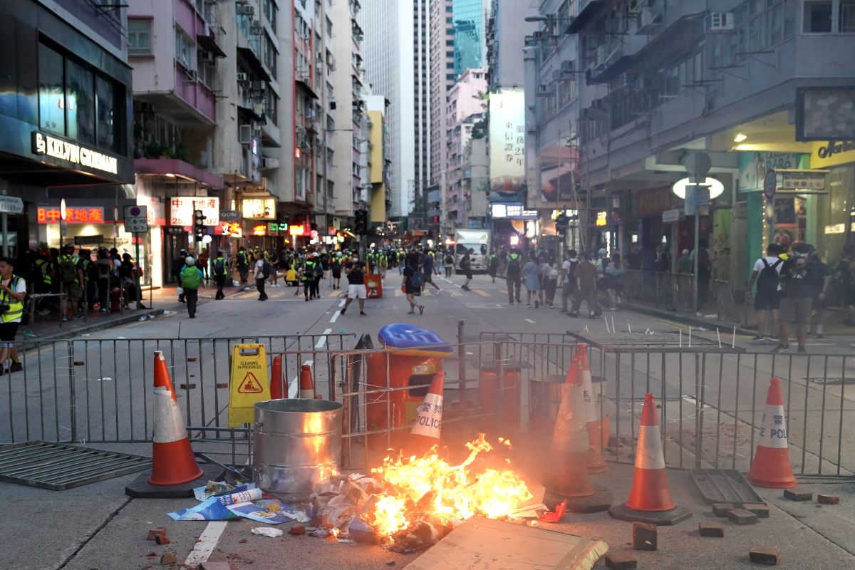 Tear gas fired as HK protesters block roads