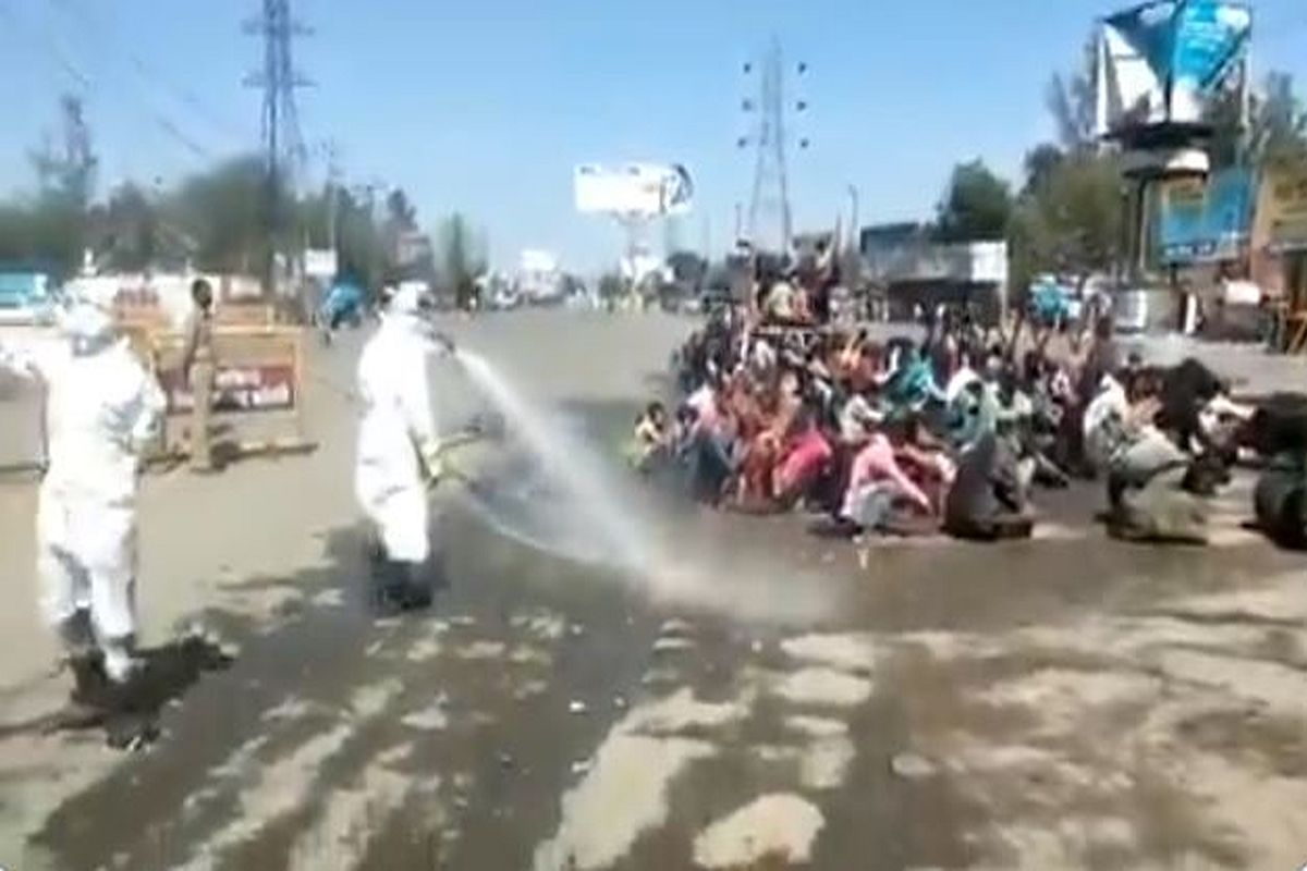Video | Migrant workers returning home sprayed with ‘chemical solution’ in UP