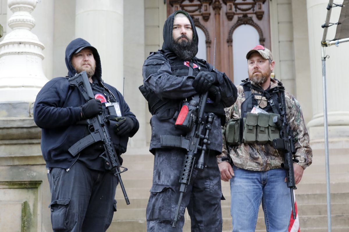 Protesters carrying guns storm Michigan capitol building seeking