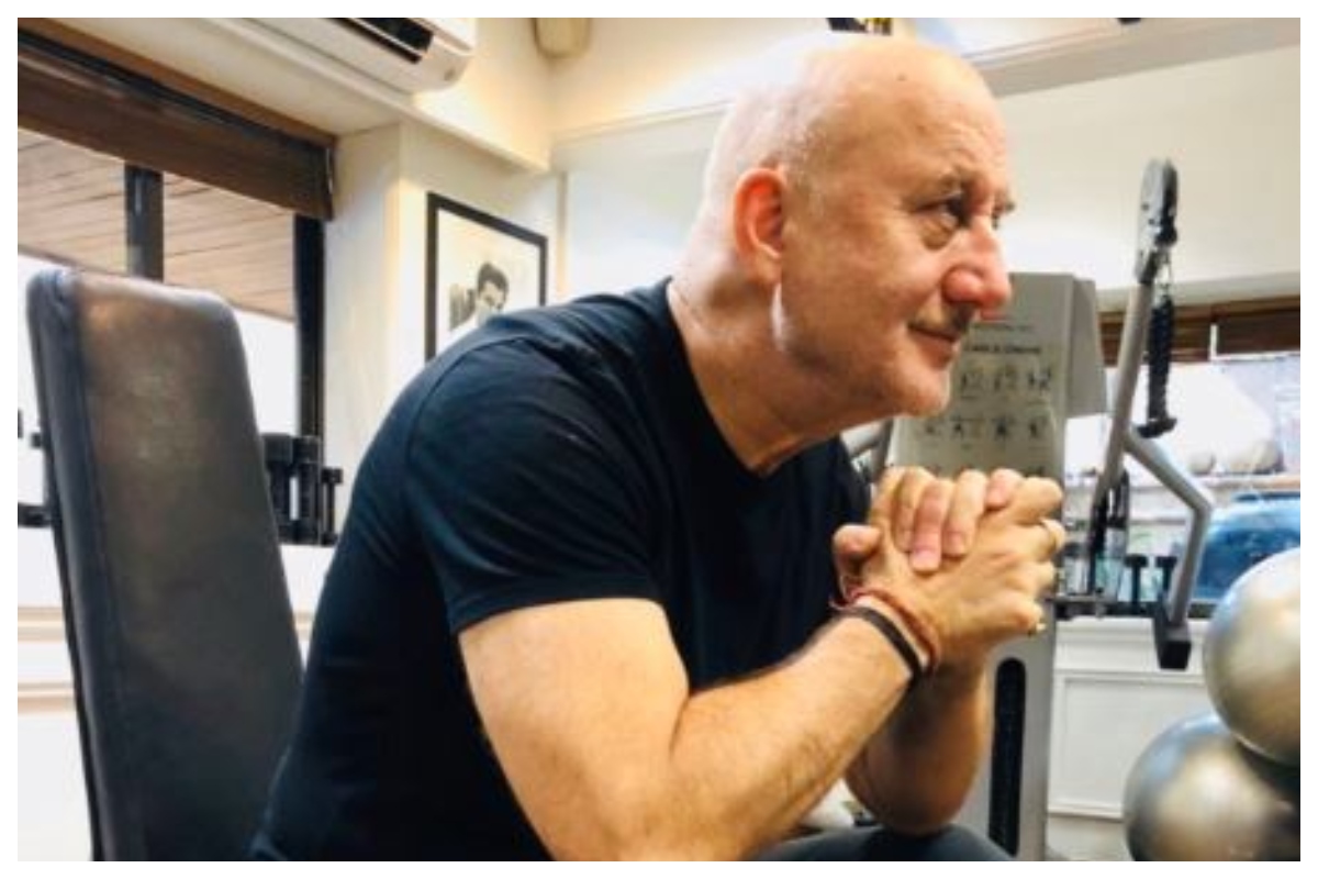 Anupam Kher gifts his latest book to Amitabh Bachchan