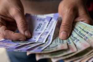 Rupee settles 3 paise higher at 75.55 against US dollar