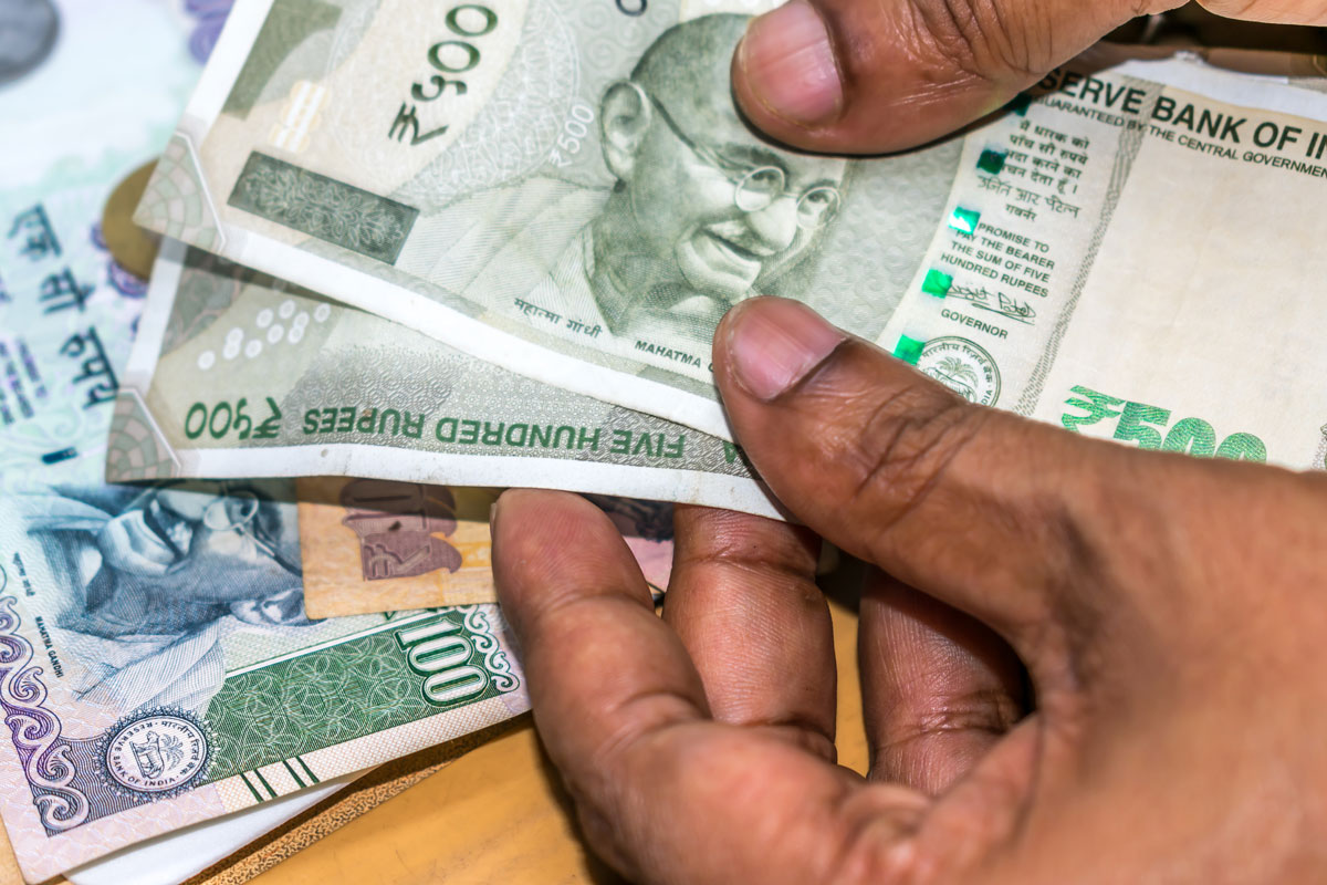 Rupee settles marginally higher at 75.59 against US dollar